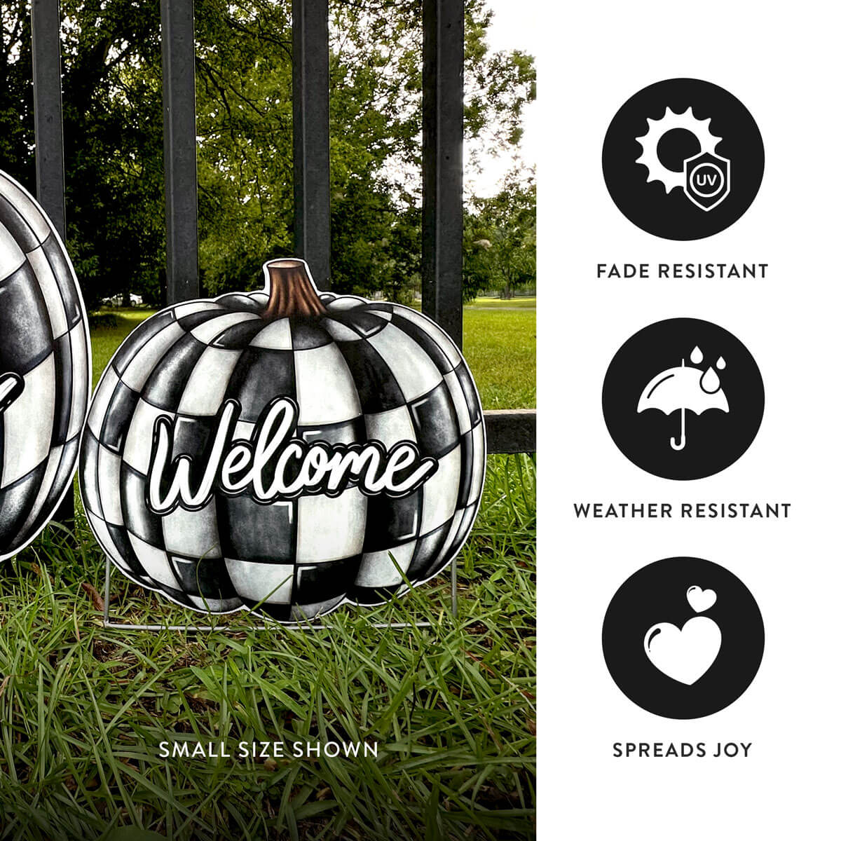 Black and white checkered pumpkin-shaped corrugated sign with 'Welcome' text, placed outdoors on grass.
