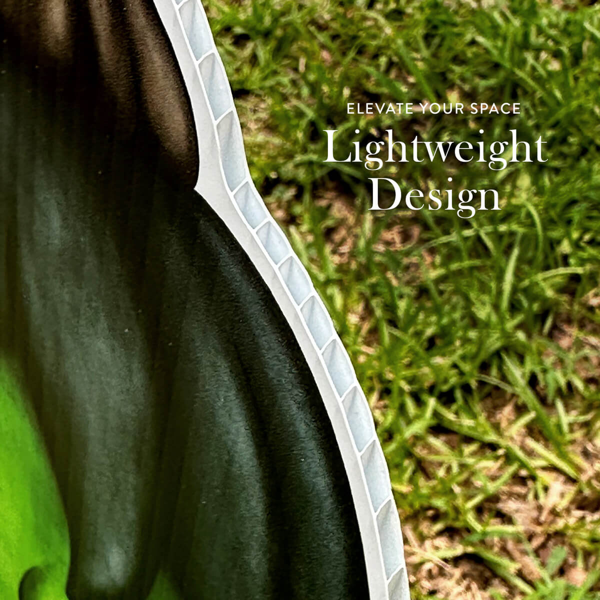 Close-up of a green outdoor Halloween Yard Sign with text 'Elevate Your Space' and 'Lightweight Design' on a grass background.