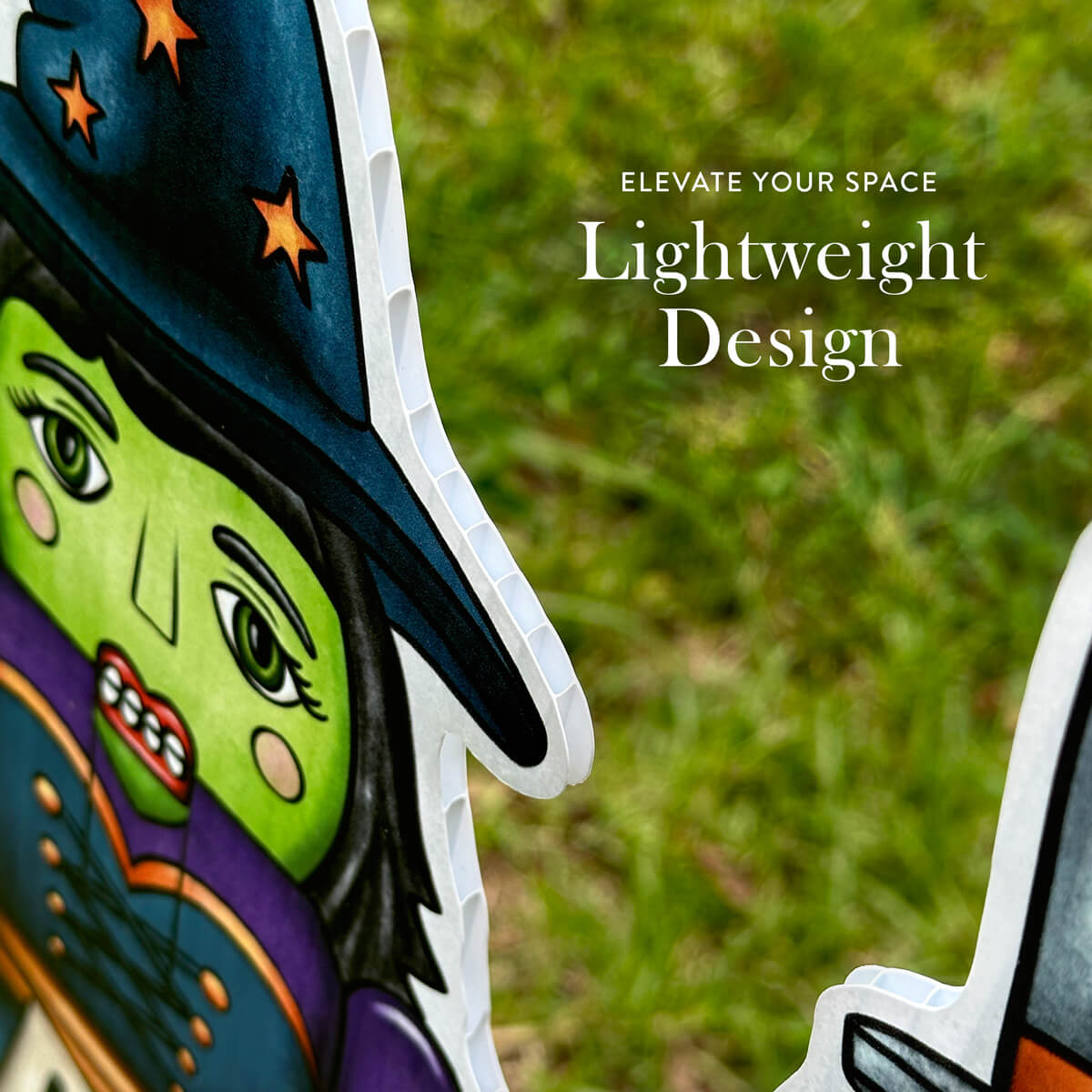 Colorful witch-shaped decoration with text 'Elevate Your Space' and 'Lightweight Design' on a grassy background.