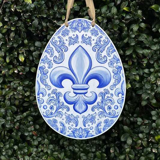 Blue & White Chinoiserie Easter Egg door hanger with large fleur de lis on green leaf background 