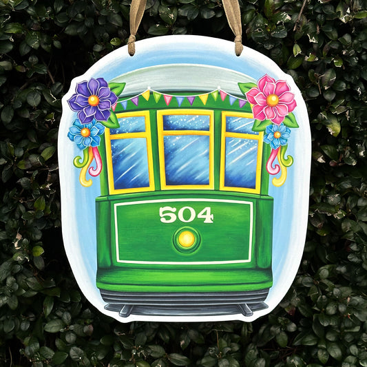 Spring Streetcar Door Hanger with Carnival Flowers and a colorful ribbon banner with the numbers 504 on it.