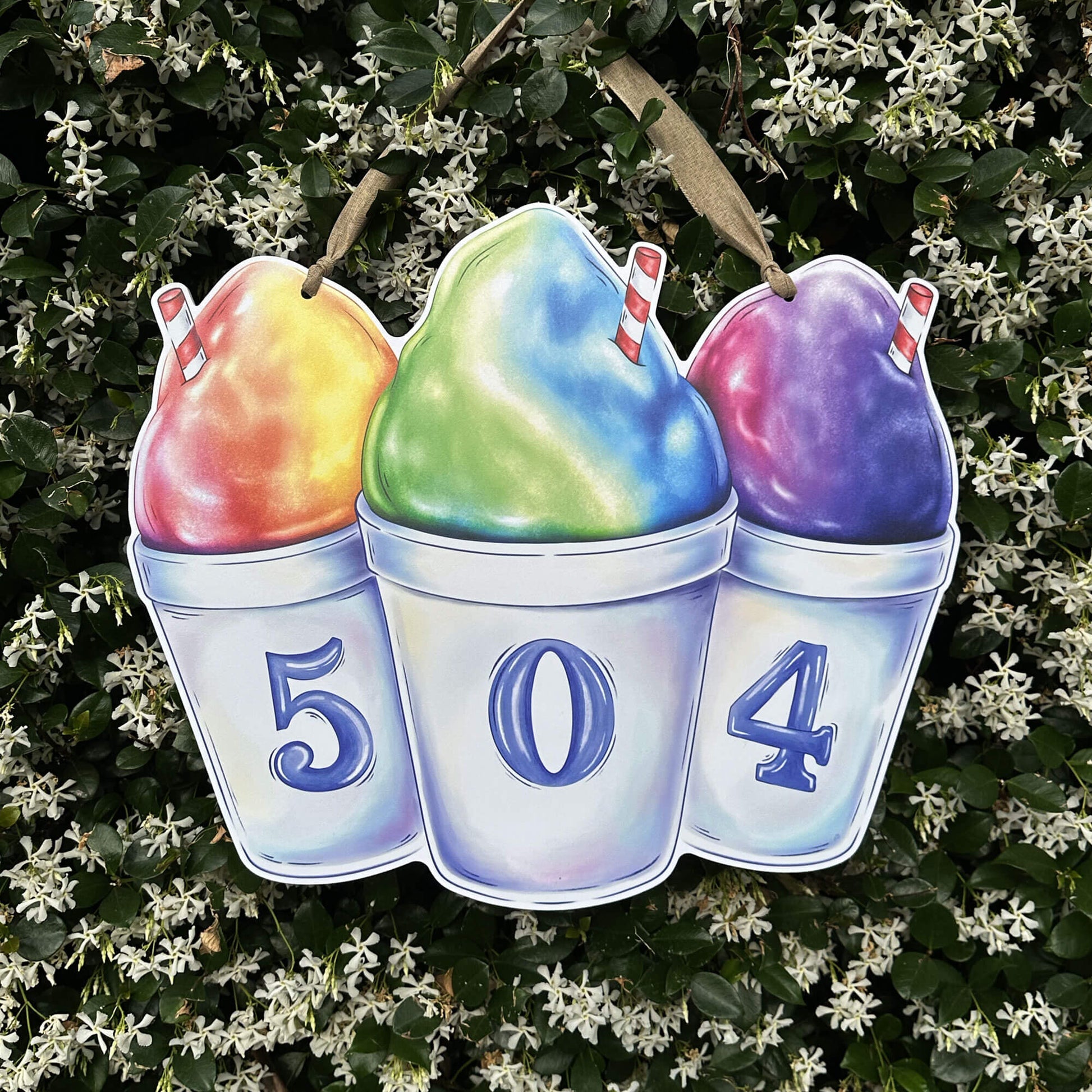 Colorful snoball door hanger with numbers 504 on them on a jasmine, green leafy background